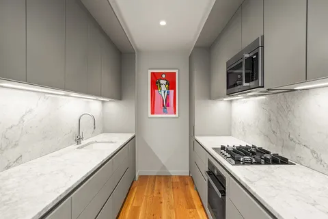 a kitchen with a stove and a sink