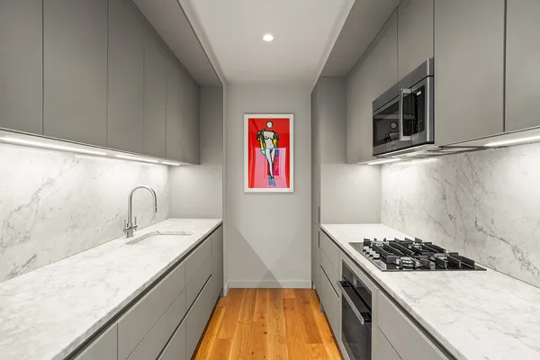 a kitchen with a stove and a sink