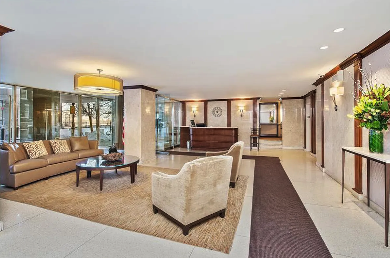 530 East 72nd Street, Unit 4F Manhattan, NY 10021 - Photo 17 of 23 a living room with furniture and a large window