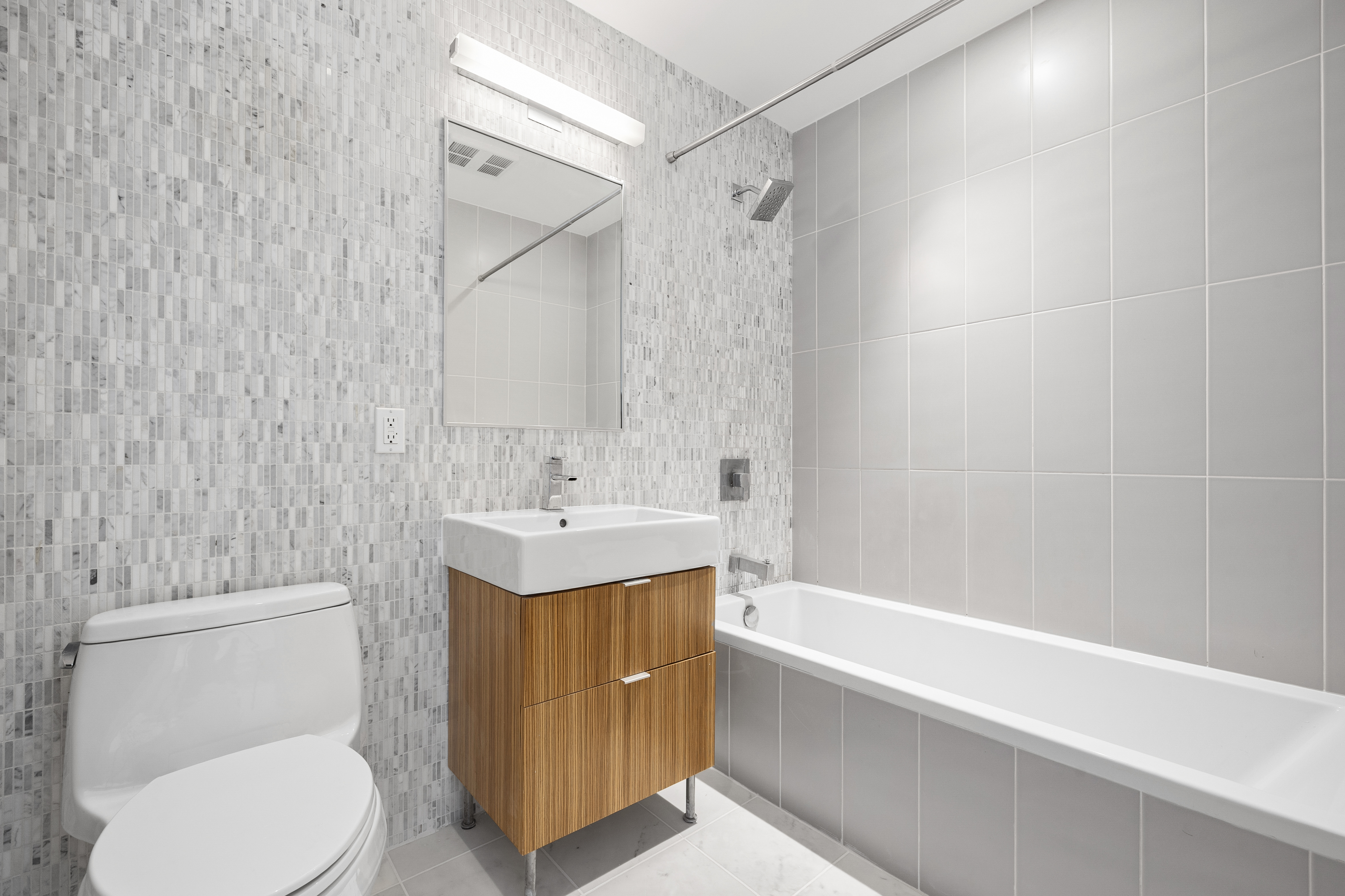 202 8th Street, Unit 7D Brooklyn, NY 11215 - Photo 7 of 19 a bathroom with a sink toilet and shower