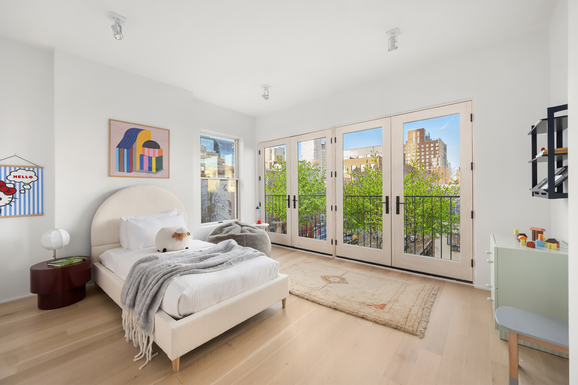 61 South 4th Street Brooklyn, NY 11249 - Photo 19 of 29 a spacious bedroom with a bed and a large window