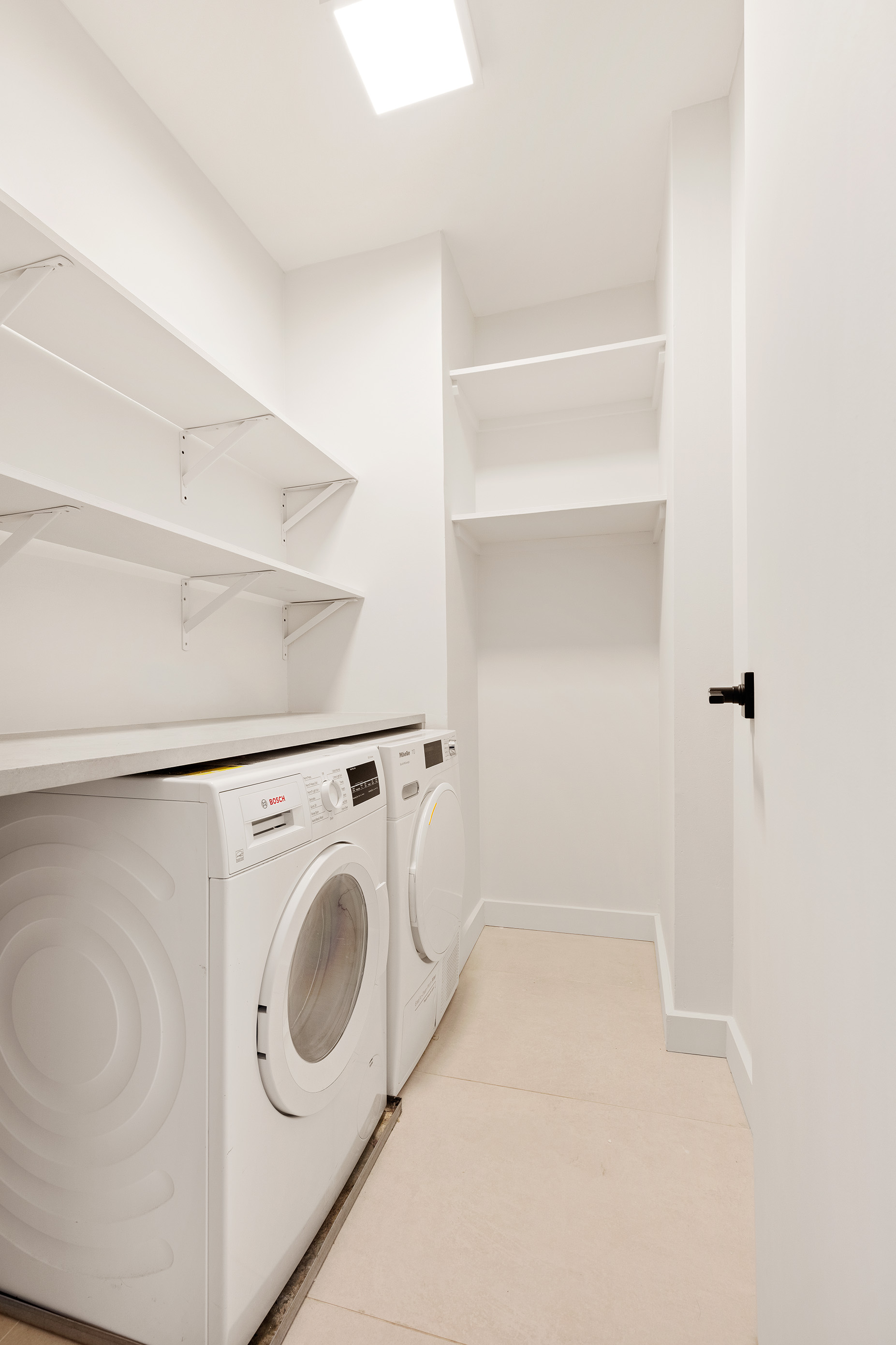 171 East 84th Street, Unit 25B/C Manhattan, NY 10028 - Photo 10 of 13 a utility room with dryer and washer