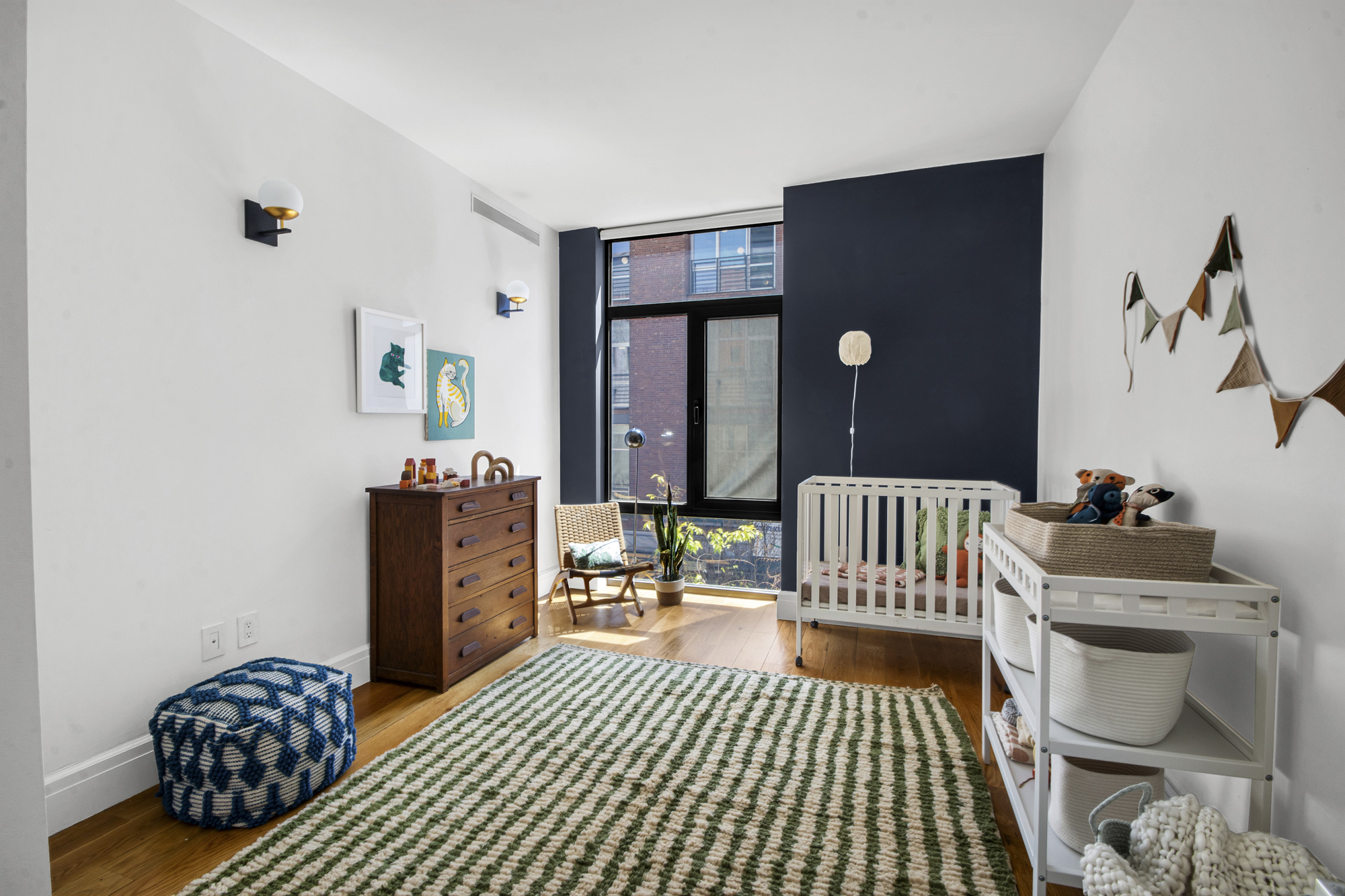 47 Bridge Street, Unit 3DD Brooklyn, NY 11201 - Photo 11 of 24 a bedroom with furniture and wooden floor