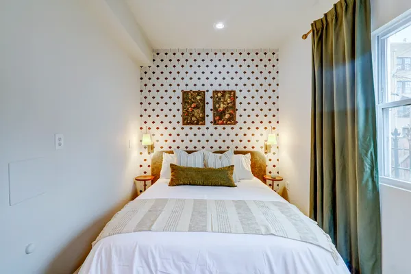 a bedroom with a bed and a cabinets