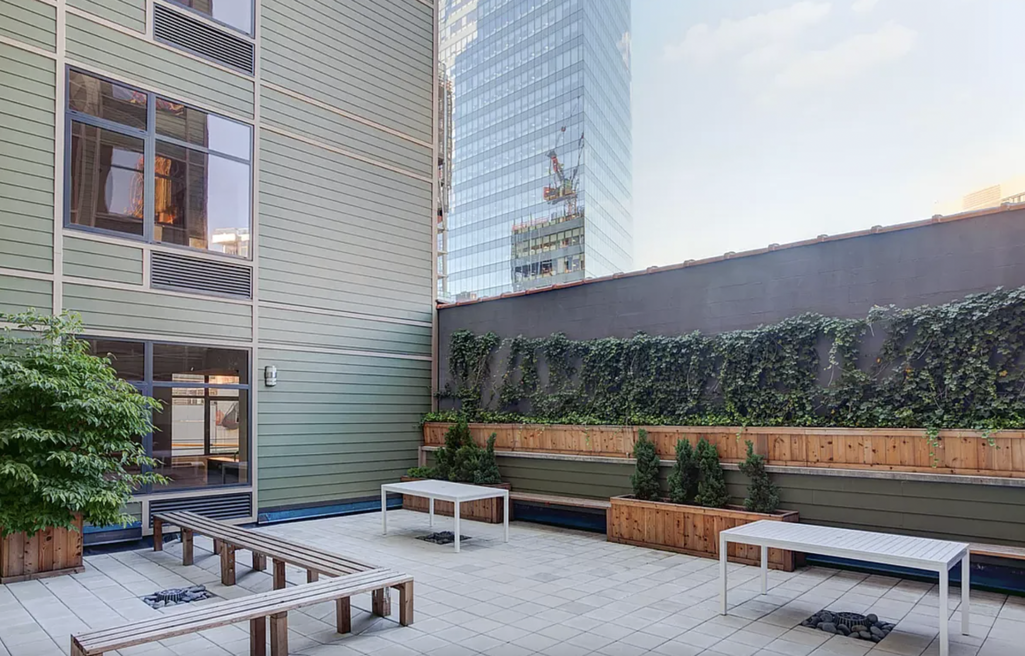 42-37 27th Street, Unit 8C Queens, NY 11101 - Photo 10 of 11 a view of a bench in a patio