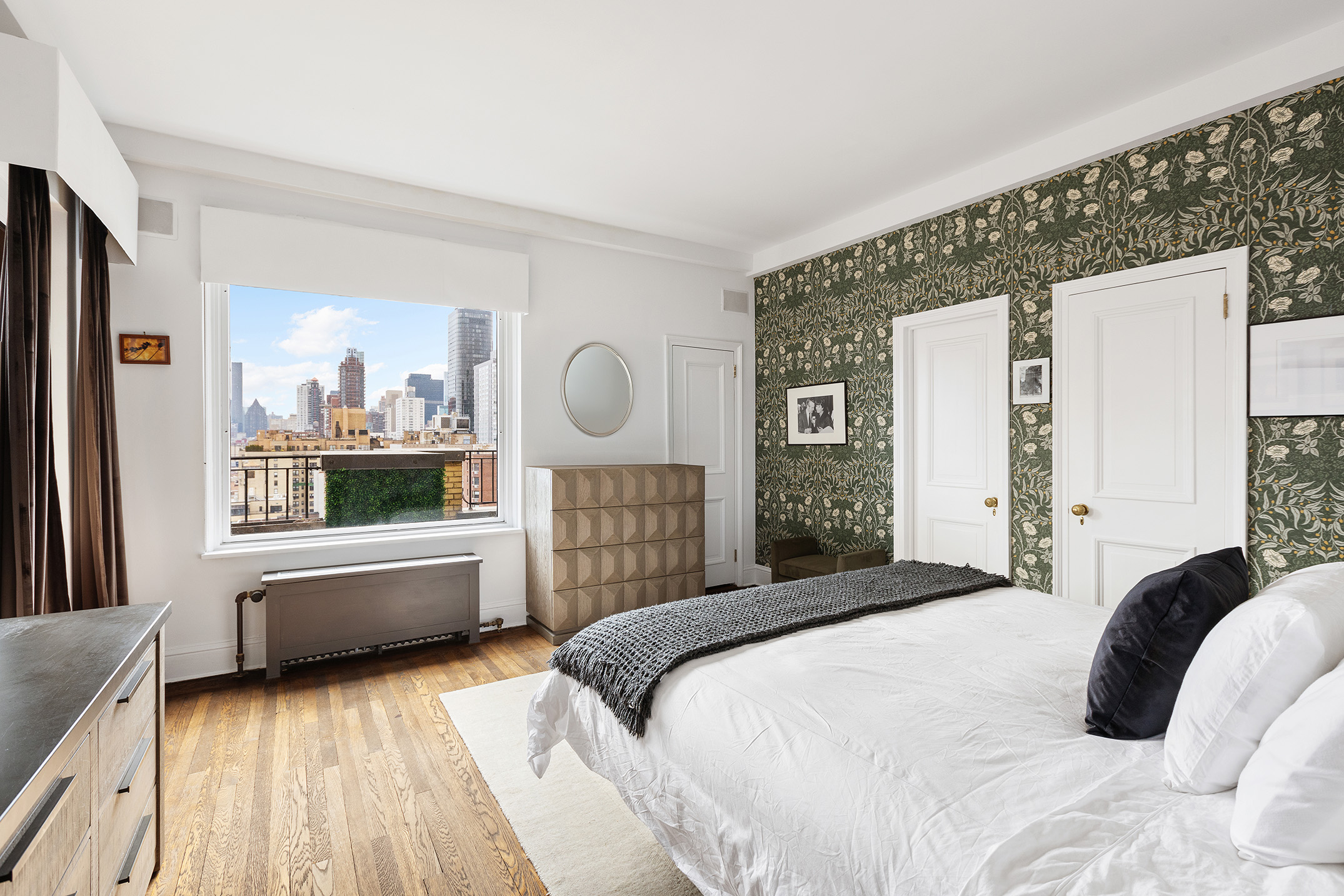 320 East 72nd Street, Unit PHB Manhattan, NY 10021 - Photo 13 of 26 a bedroom with a large bed and a large window