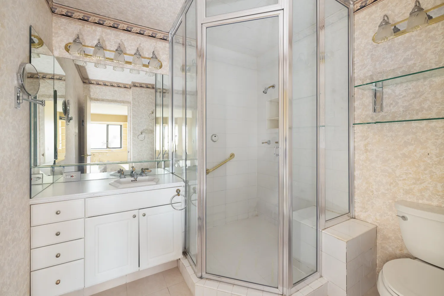 a bathroom with a granite countertop sink toilet and shower