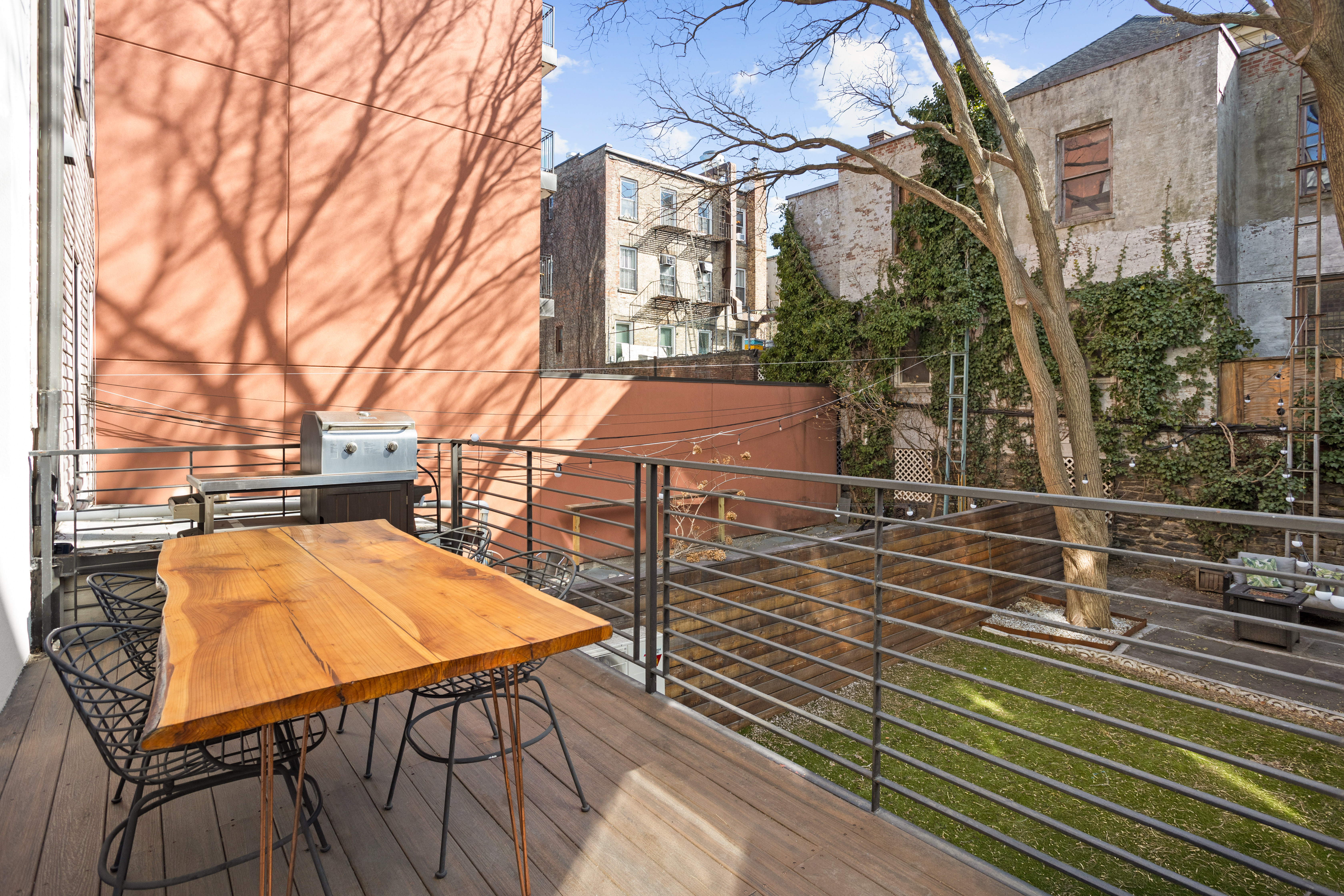 146 1/2 Java Street Brooklyn, NY 11222 - Photo 5 of 23 a view of a chairs and table on the wooden roof