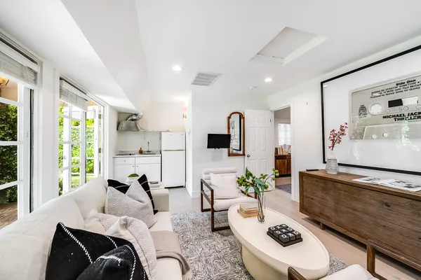 a living room with furniture and a large window