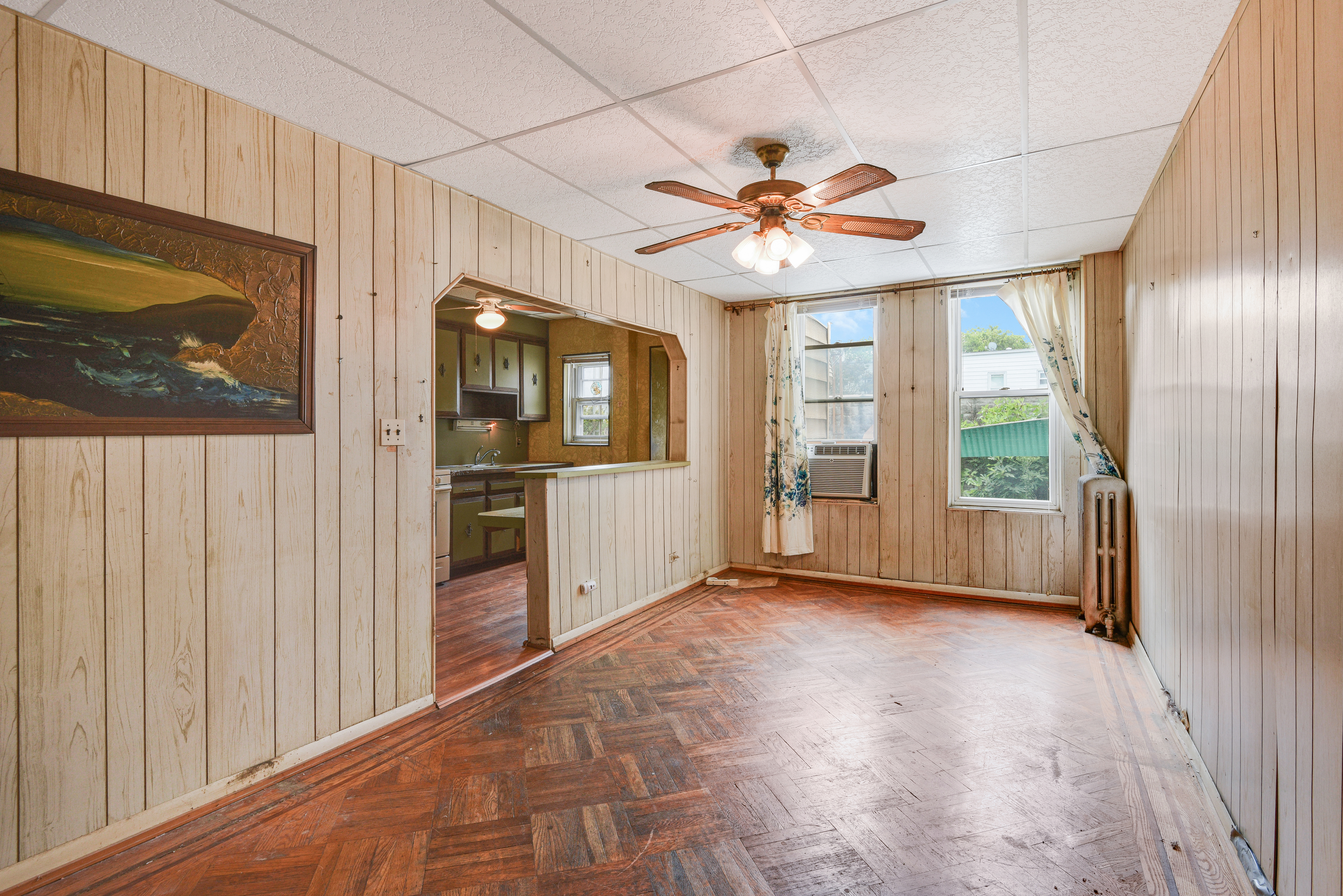 75-36 60th Lane Queens, NY 11385 - Photo 6 of 18 a view of a livingroom with a flat screen tv