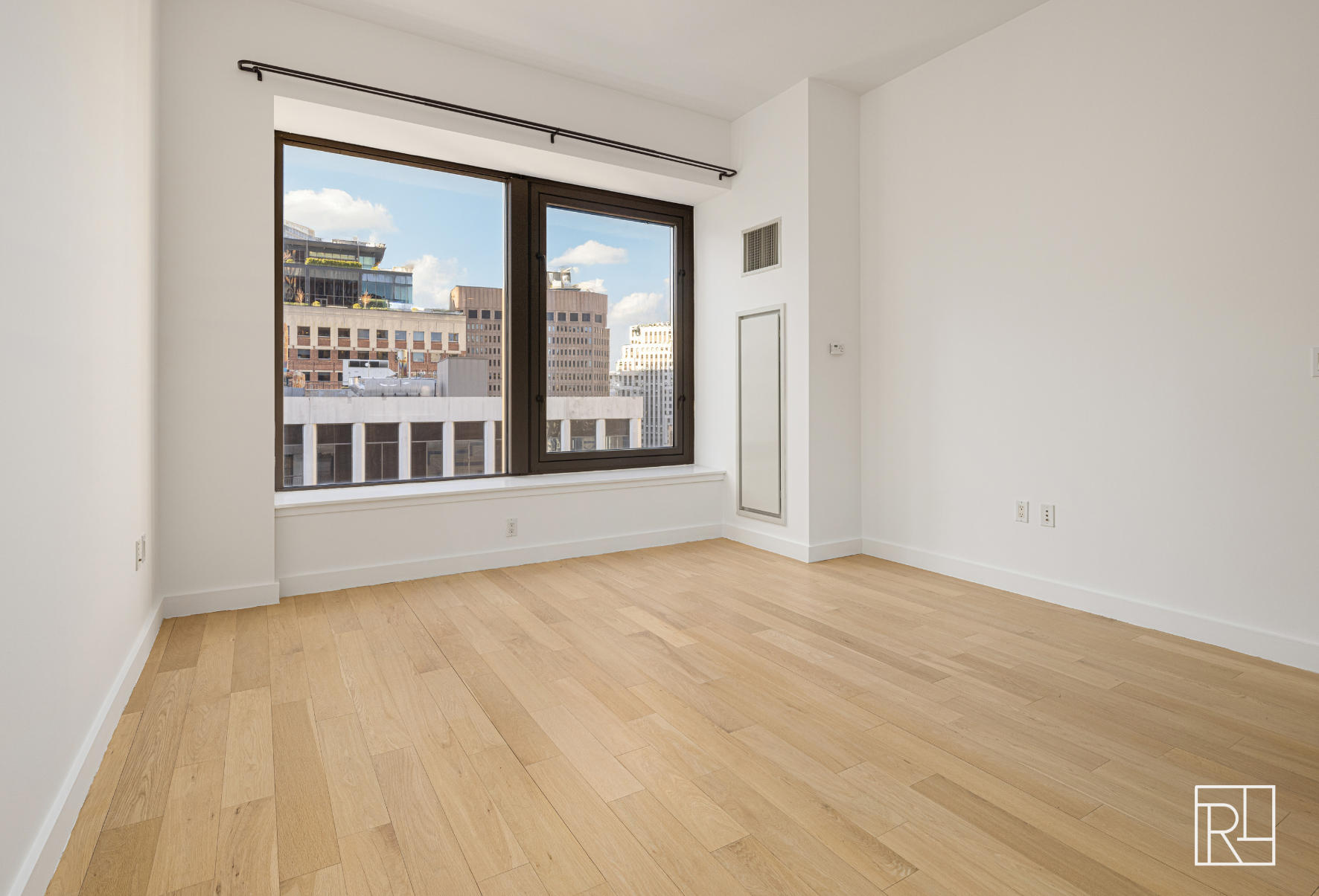 75 Wall Street, Unit 28D Manhattan, NY 10005 - Photo 13 of 35 a view of an empty room with a window