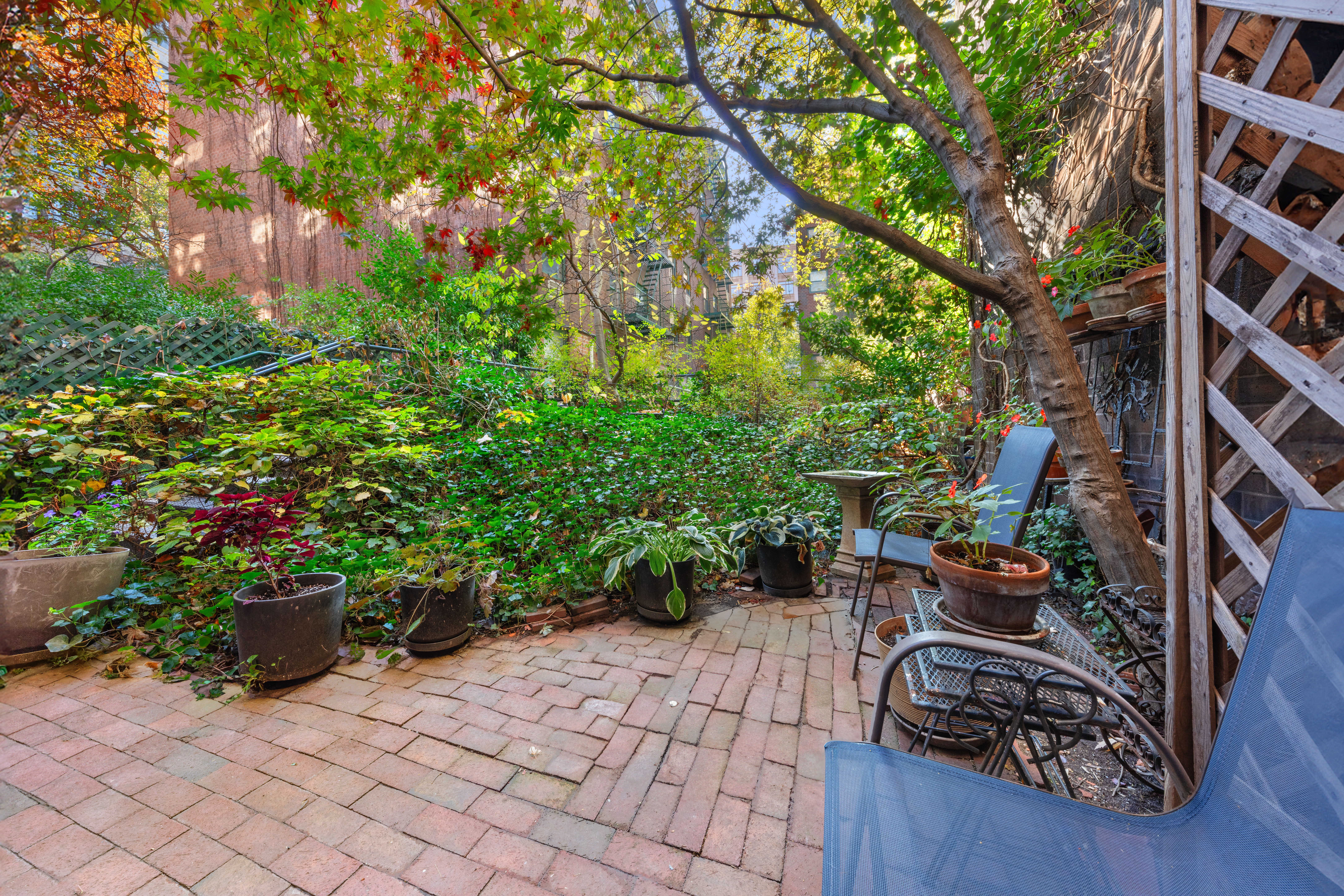 129 Barrow Street, Unit GA Manhattan, NY 10014 - Photo 7 of 17 a garden view with a seating space
