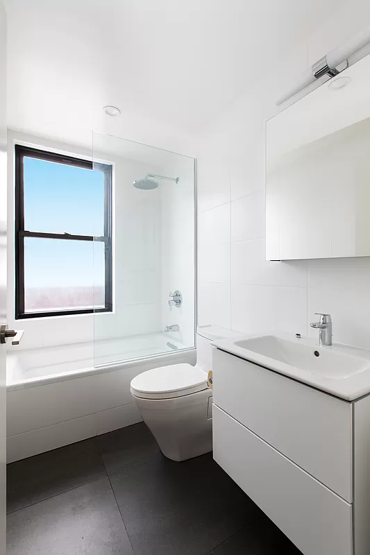 230 Riverside Drive, Unit 17D Manhattan, NY 10025 - Photo 7 of 18 a bathroom with a sink and a bathtub