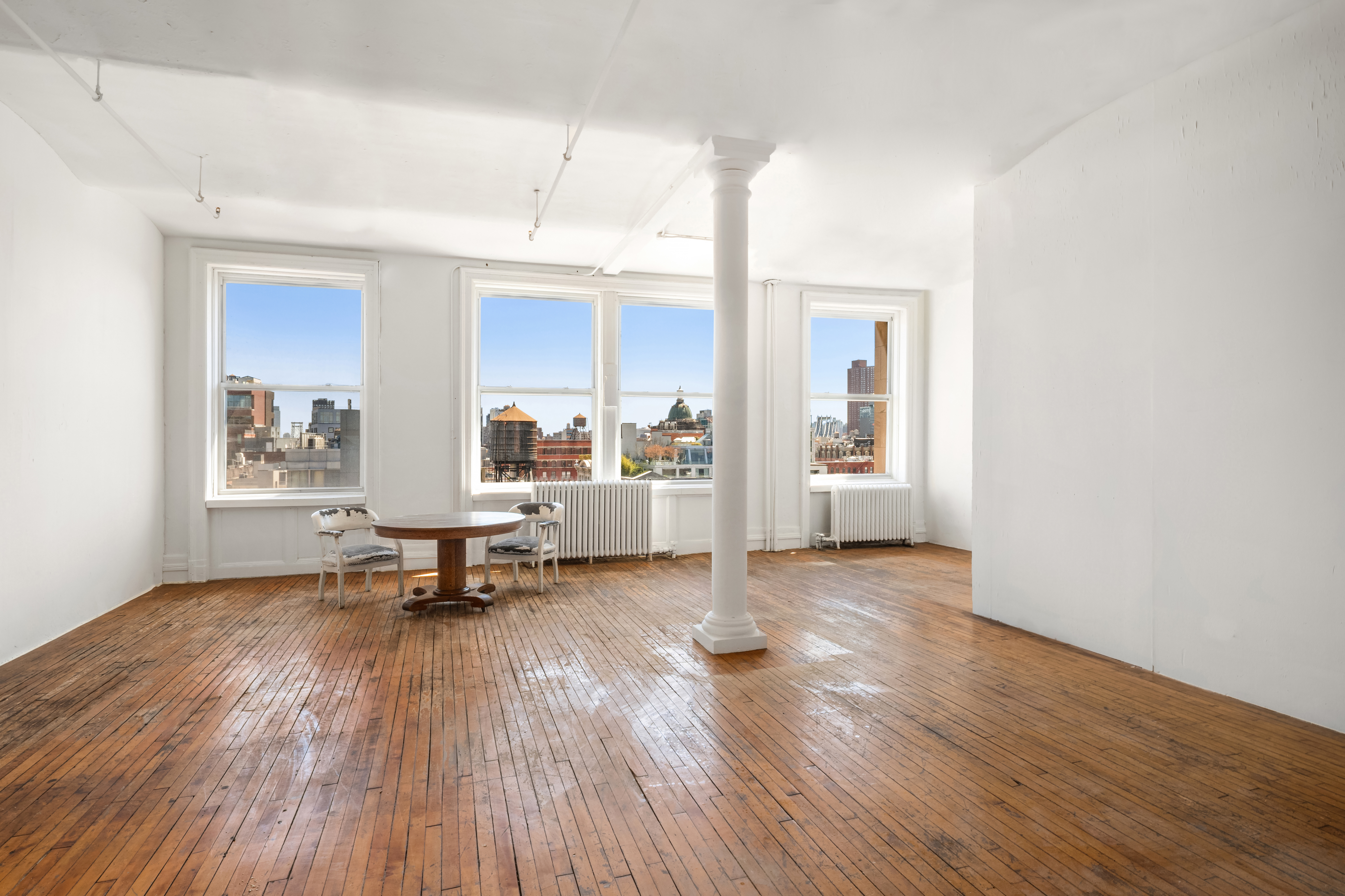 491 Broadway Manhattan, NY 10012 - Photo 3 of 11 a living room with furniture and a wooden floor