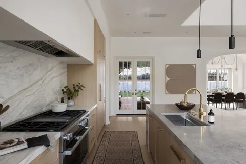 a kitchen with a stove and a sink