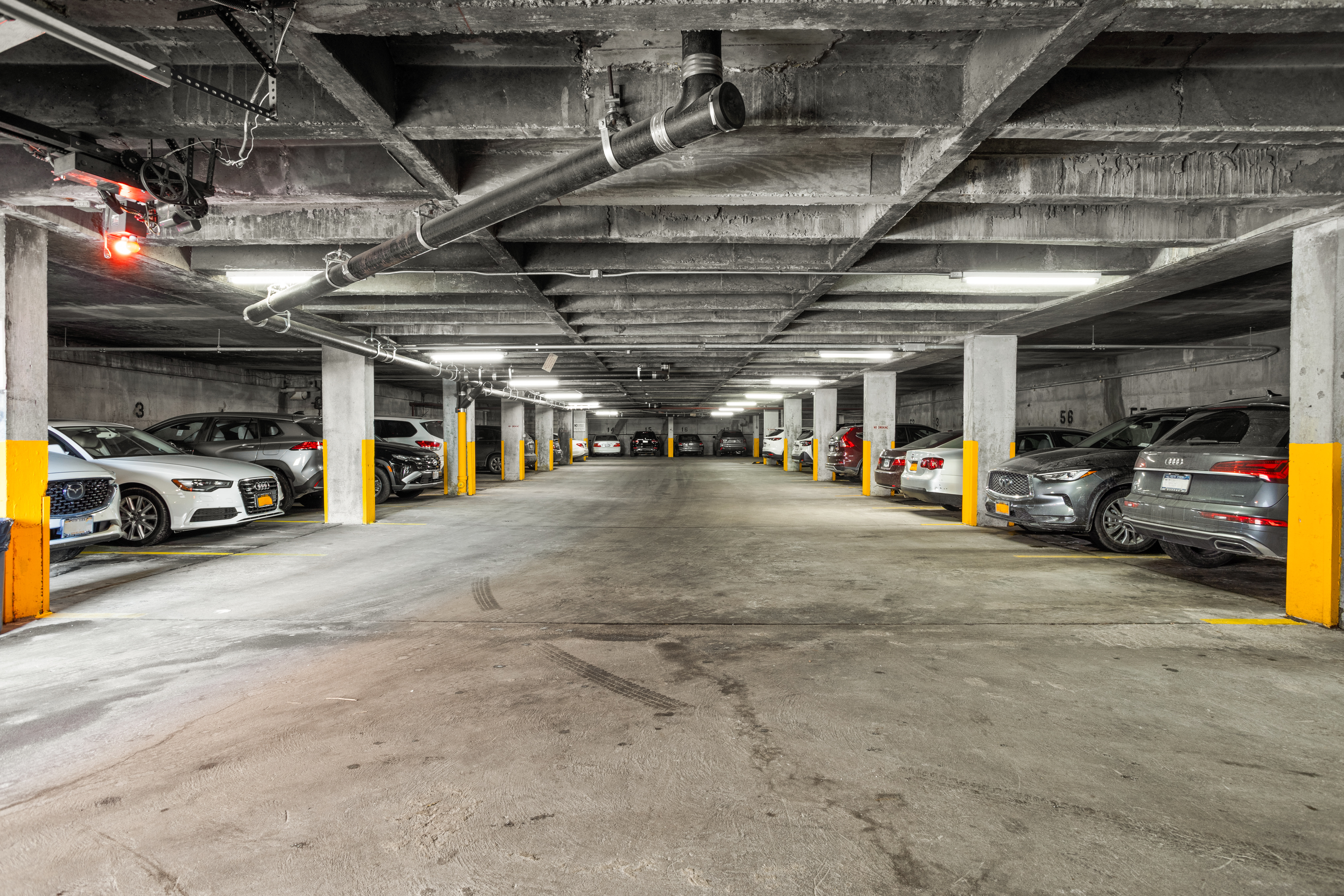 39-60 54th Street, Unit 4R Queens, NY 11377 - Photo 12 of 14 a view of parking garage with cars