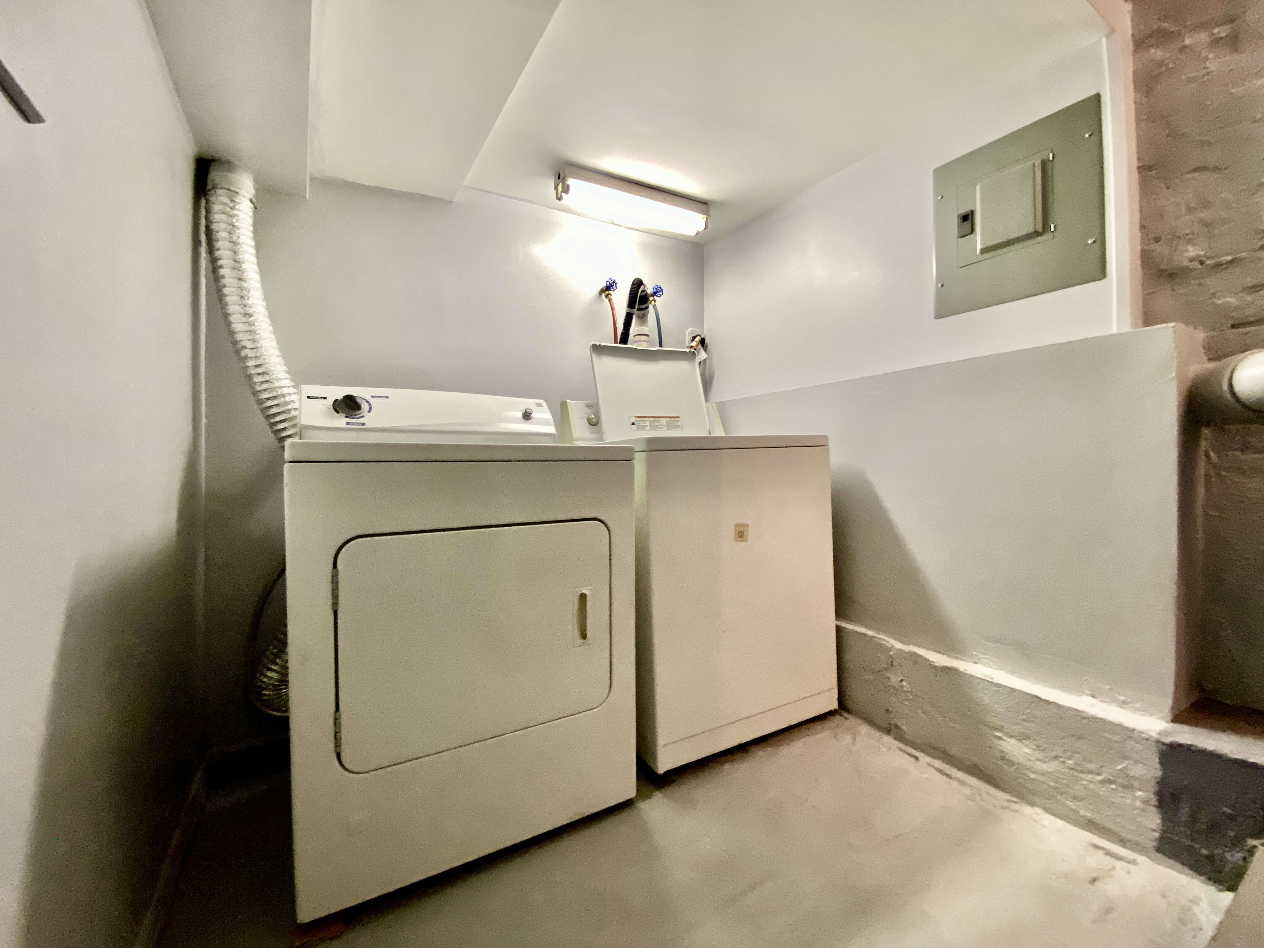447 Degraw Street, Unit 1 Brooklyn, NY 11217 - Photo 10 of 11 a utility room with cabinets washer and dryer