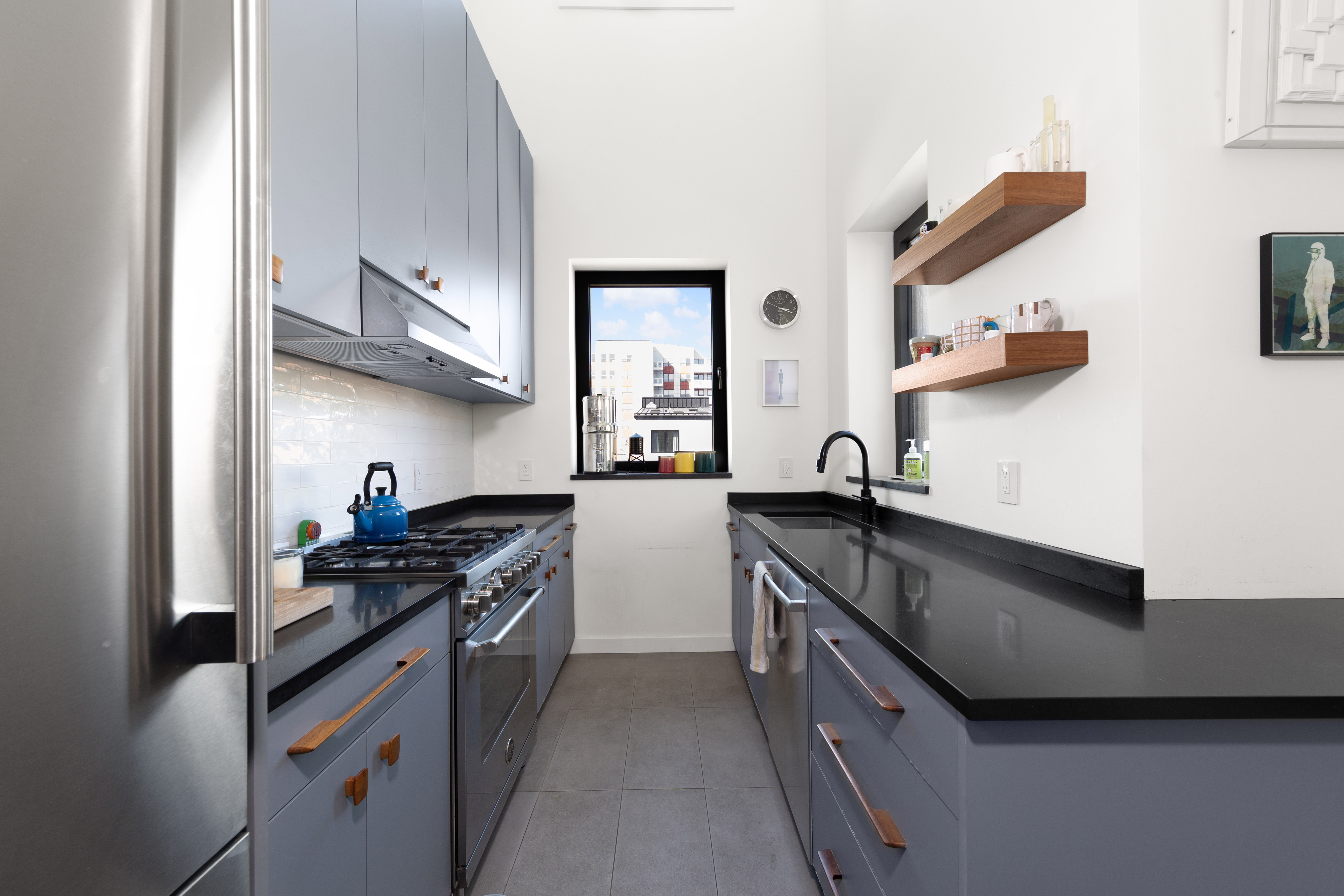 33 Conselyea Street, Unit PH Brooklyn, NY 11211 - Photo 5 of 16 a kitchen with stainless steel appliances a stove and a sink