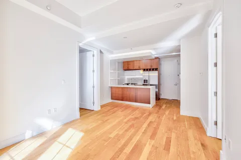 a large white bed in a white room