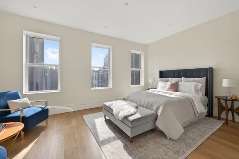 a bedroom with bed and window