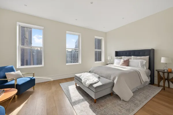 a bedroom with bed and window