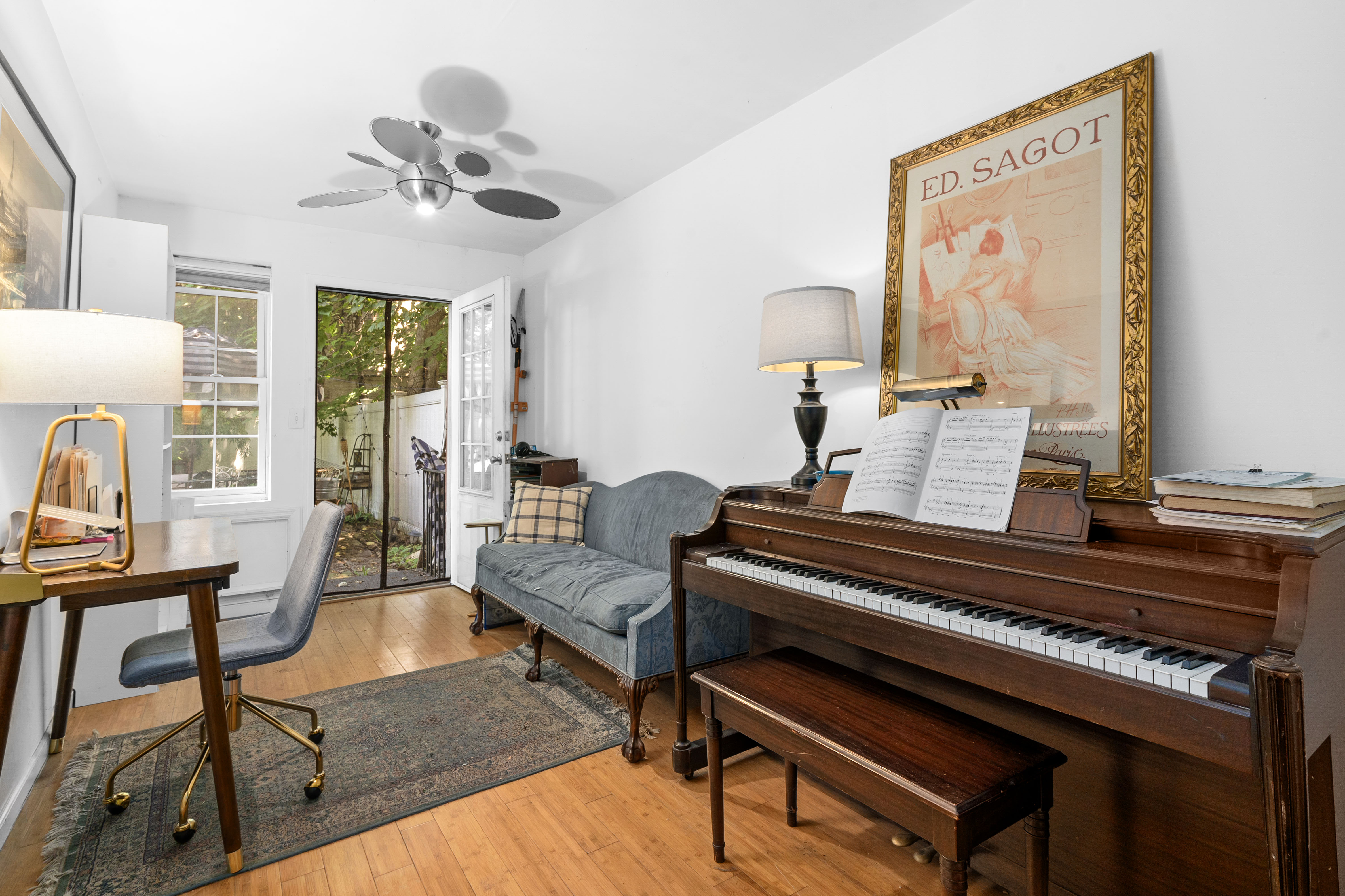 547 Gates Avenue, Unit 1 Brooklyn, NY 11216 - Photo 3 of 7 a living room with furniture and a piano