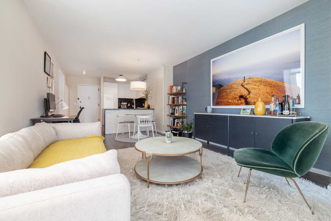 385 1st Avenue, Unit 6G Manhattan, NY 10010 - Photo 3 of 19 a living room with furniture and a wooden floor