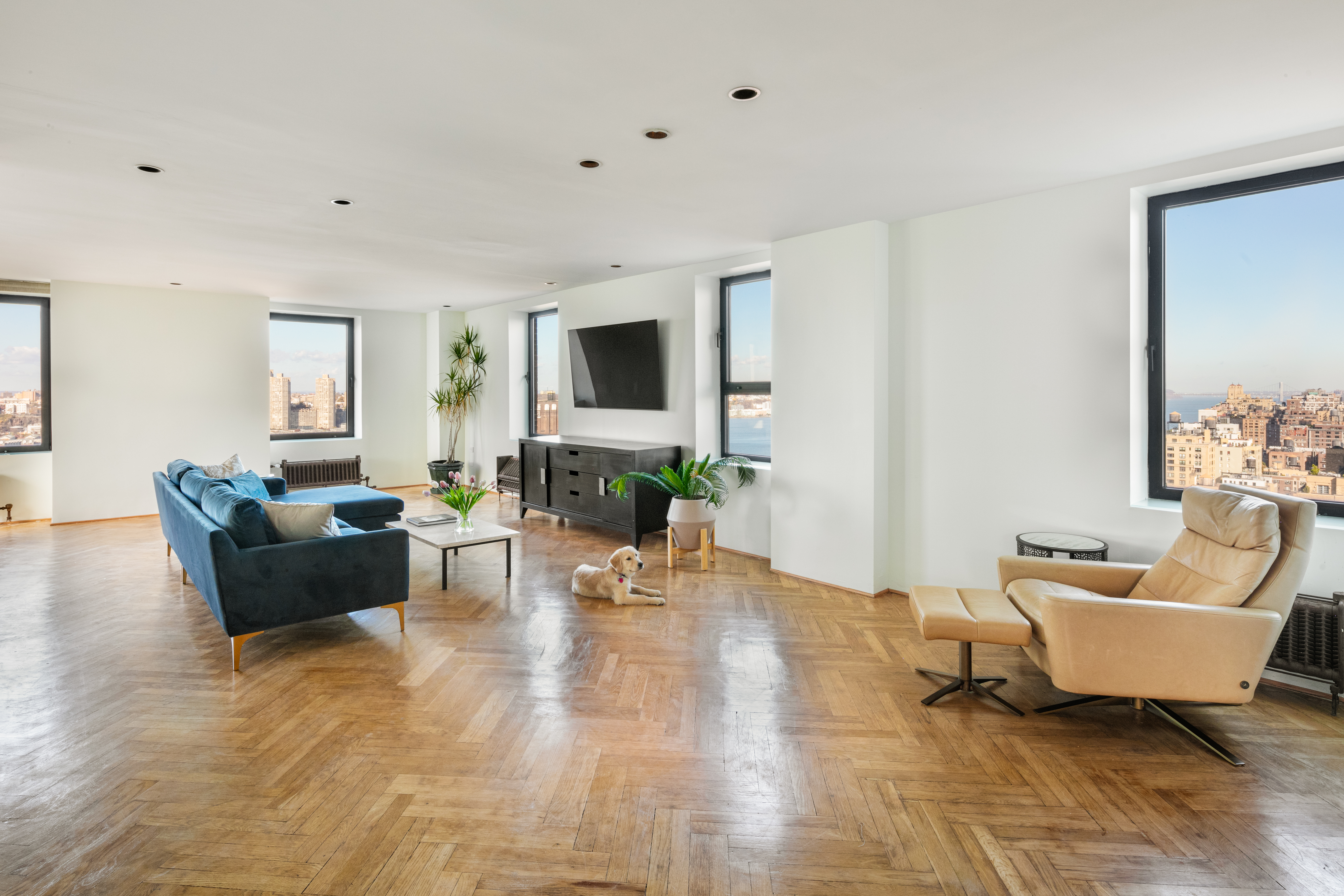 263 West End Avenue, Unit PH22B Manhattan, NY 10023 - Photo 8 of 19 a living room with furniture and a flat screen tv