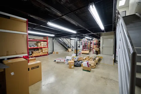 a room with lots of furniture and a projector