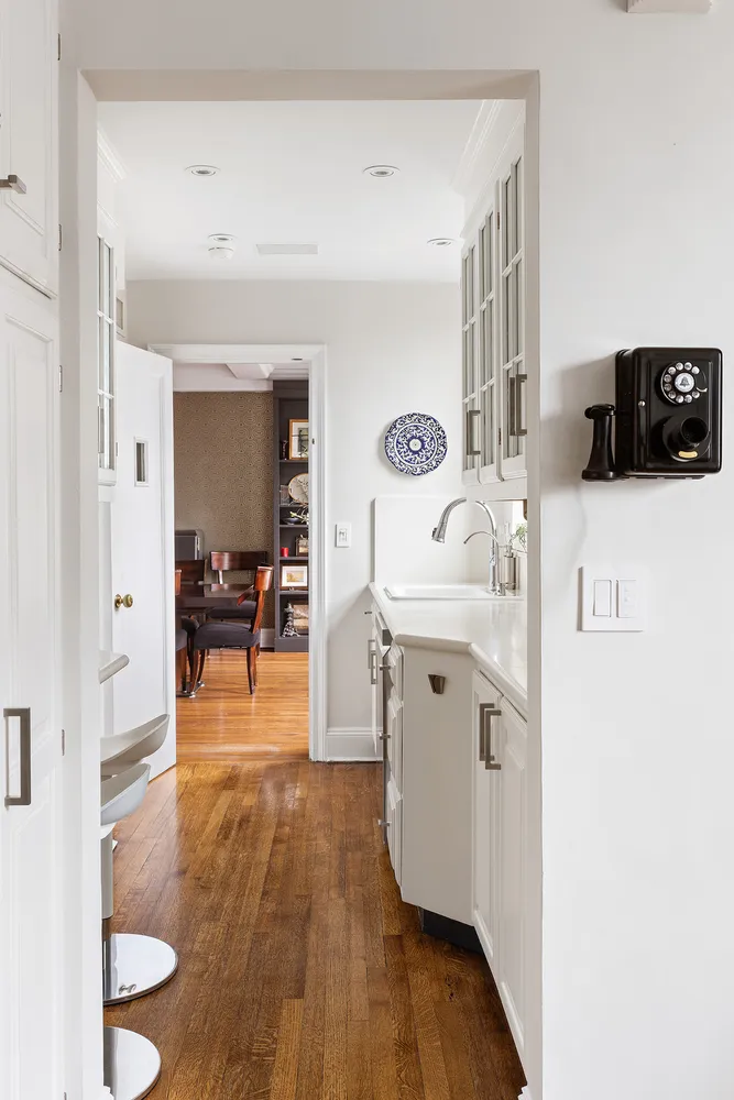 a view of living room with furniture and wooden floor