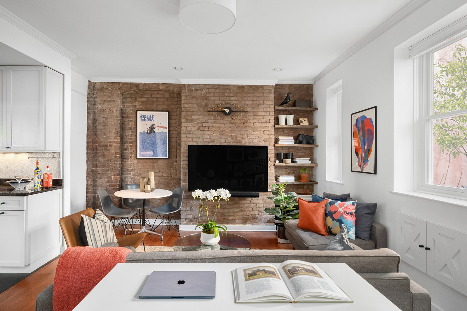 337 West 20th Street, Unit 1B Manhattan, NY 10011 - Photo 3 of 11 a living room with furniture and a fireplace