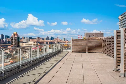 a view of a balcony with city view