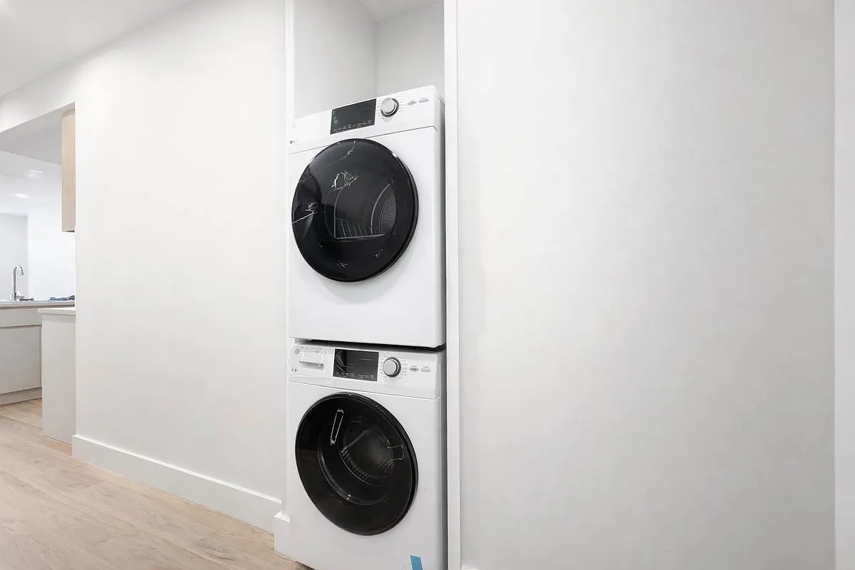242 6th Street, Unit 3A Brooklyn, NY 11215 - Photo 5 of 5 a utility room with dryer and washer