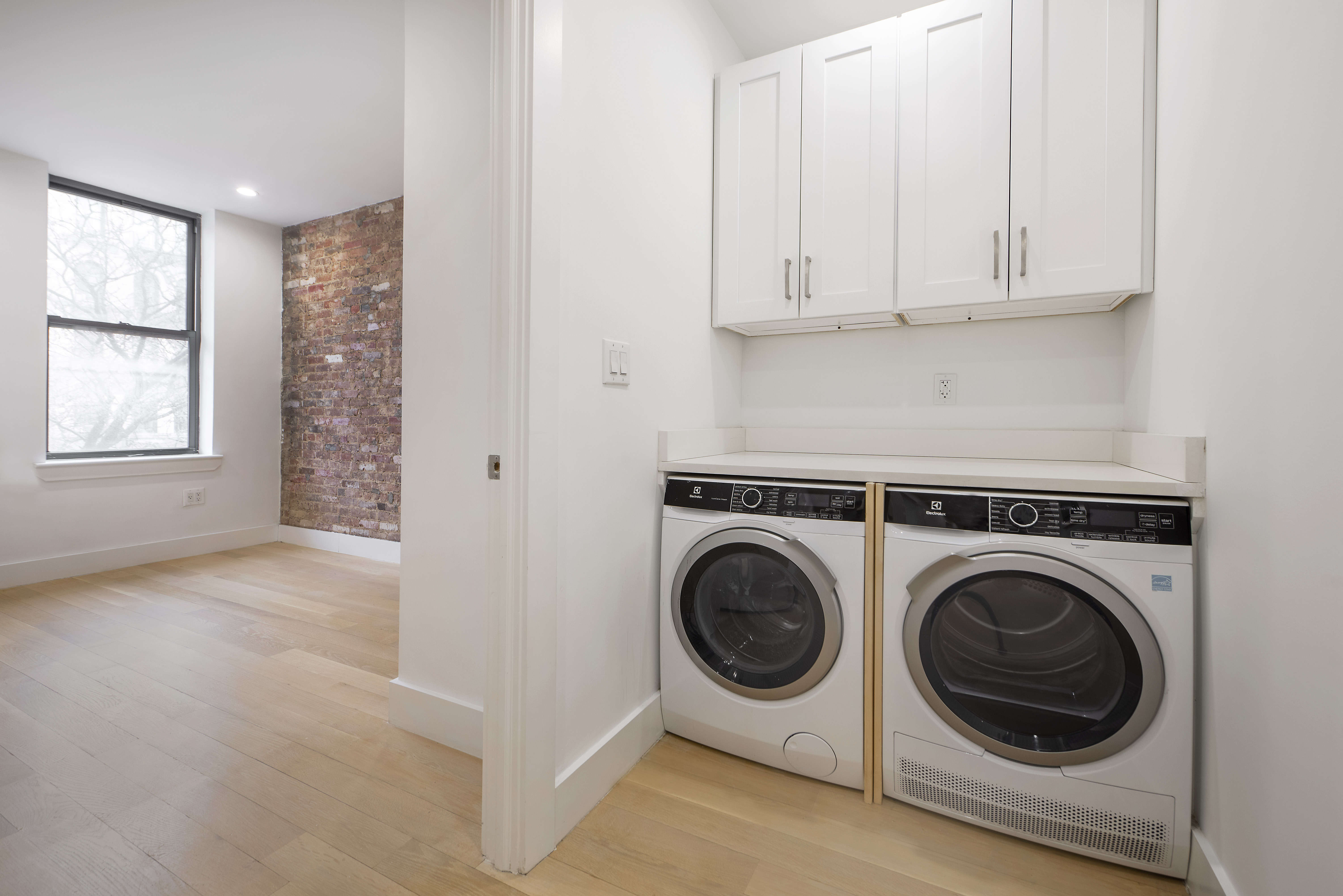 129 2nd Avenue, Unit 8 Manhattan, NY 10003 - Photo 10 of 11 a view of utility room with washer and dryer