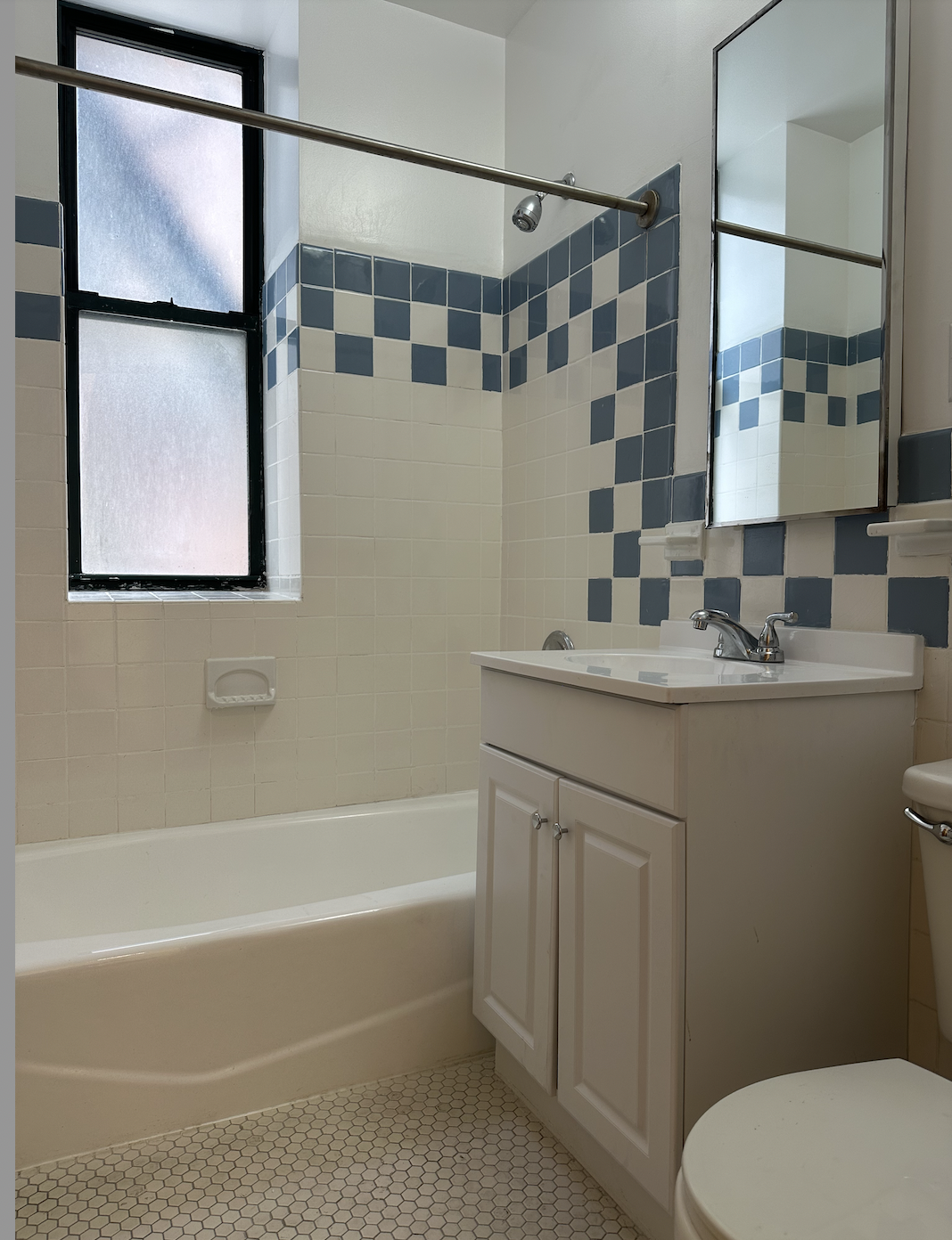 403 West 40th Street, Unit 2FE Manhattan, NY 10018 - Photo 11 of 12 a bathroom with a granite countertop sink toilet and shower