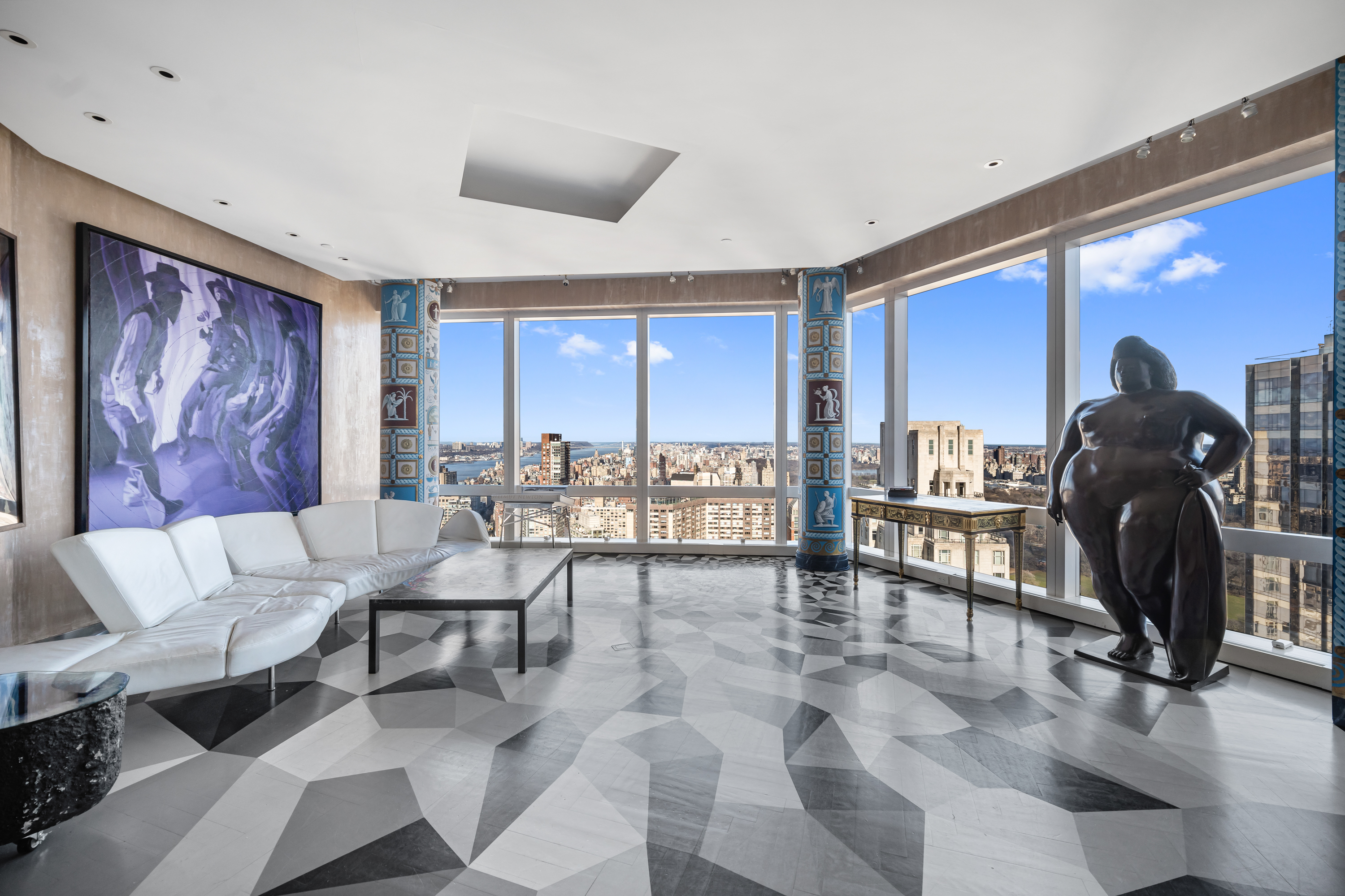 80 Columbus Circle, Unit 67B Manhattan, NY 10019 - Photo 2 of 16 a living room with furniture and a large window