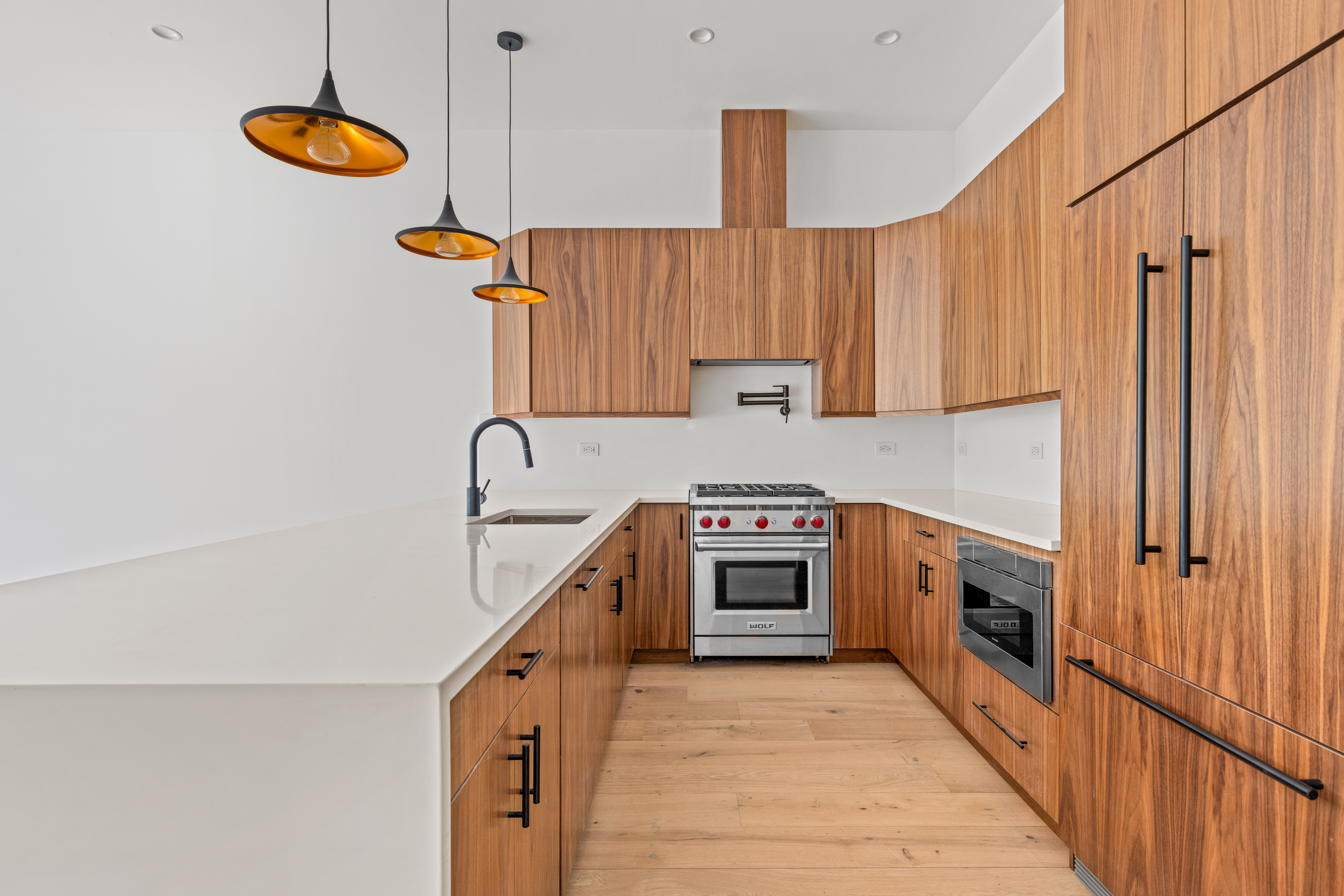 74 Carroll Street, Unit PH Brooklyn, NY 11231 - Photo 4 of 19 a kitchen with stainless steel appliances granite countertop a sink a stove and a refrigerator