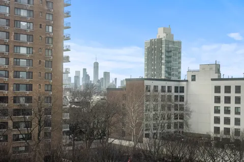 a view of a city with tall buildings