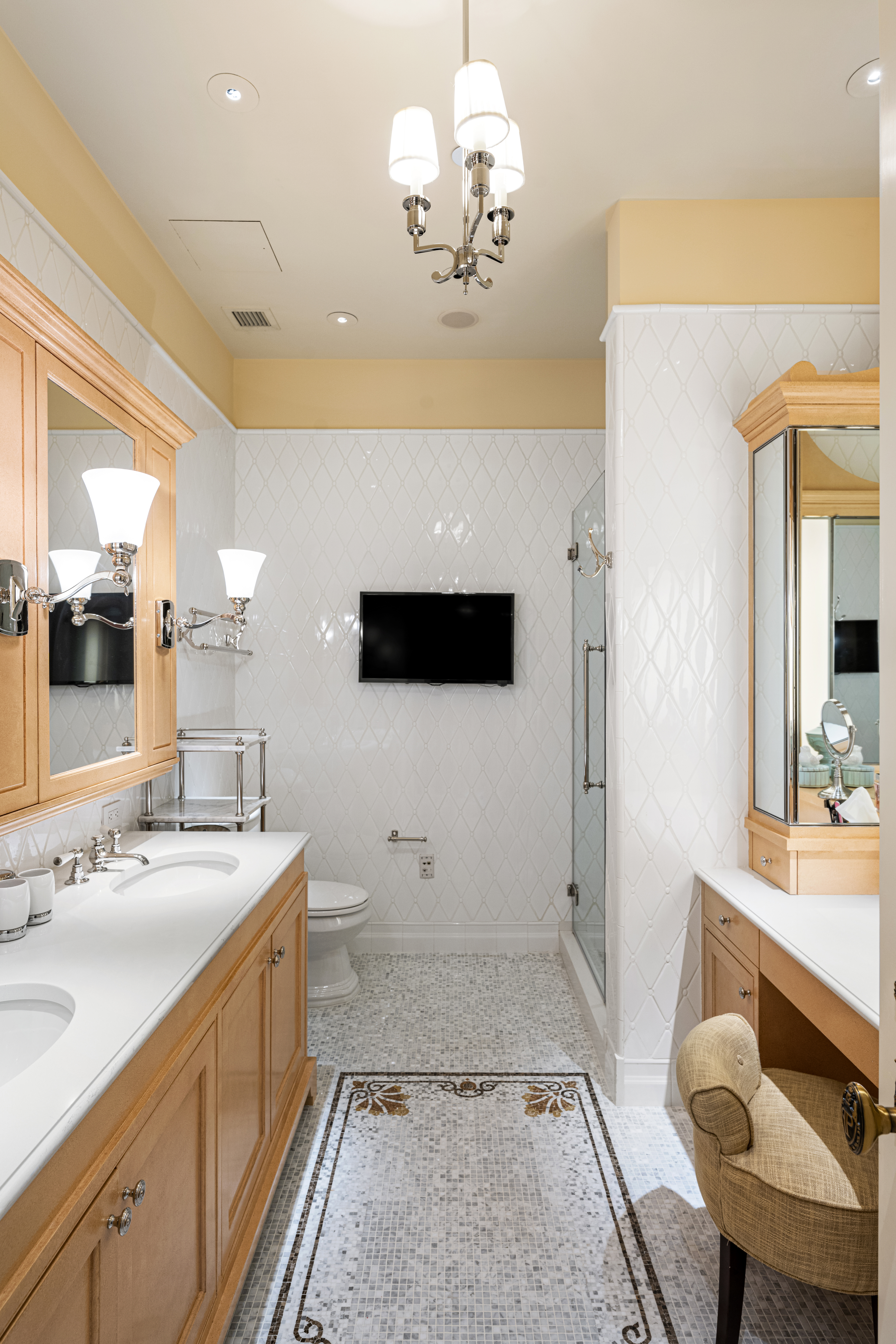 1 Central Park South, Unit 1013 Manhattan, NY 10019 - Photo 12 of 32 a spacious bathroom with a sink a large mirror and a shower
