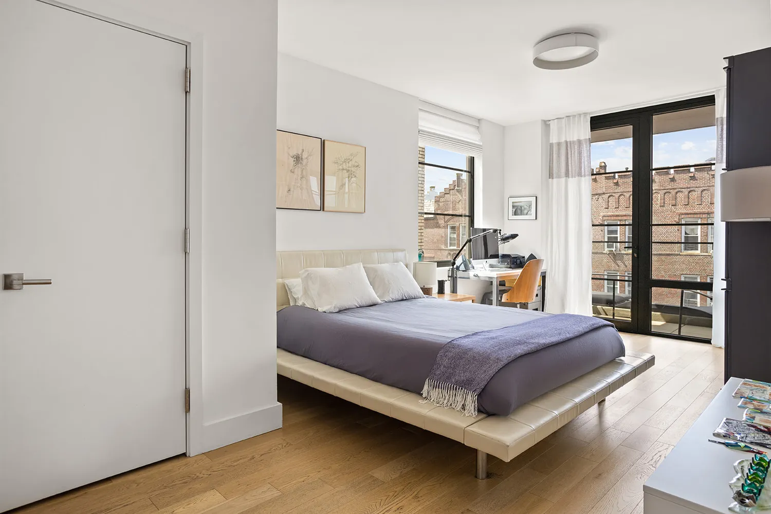 a bed room with a bed and a night stand