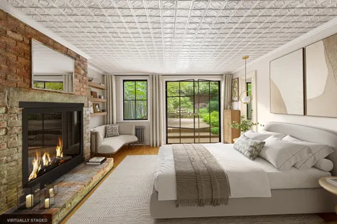 a bed room with a bed and a fireplace