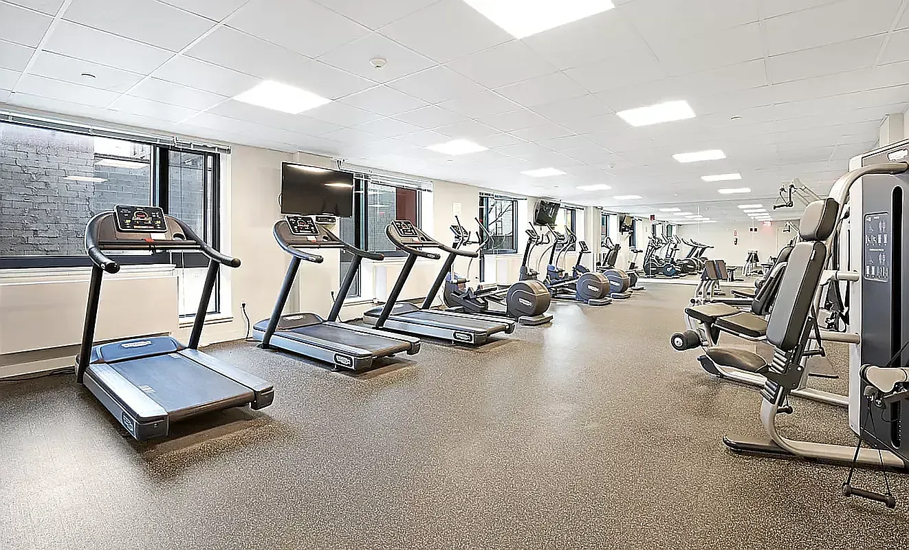 26-14 Jackson Avenue, Unit 9BB Queens, NY 11101 - Photo 6 of 8 a view of a room with gym equipment