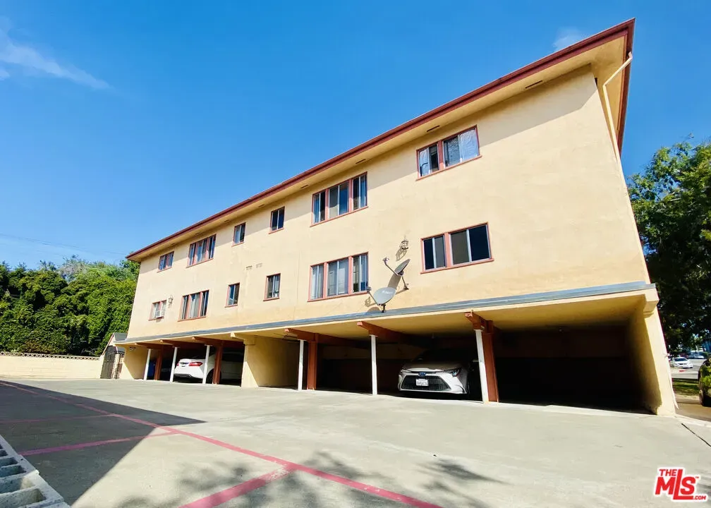 a front view of a building with many windows
