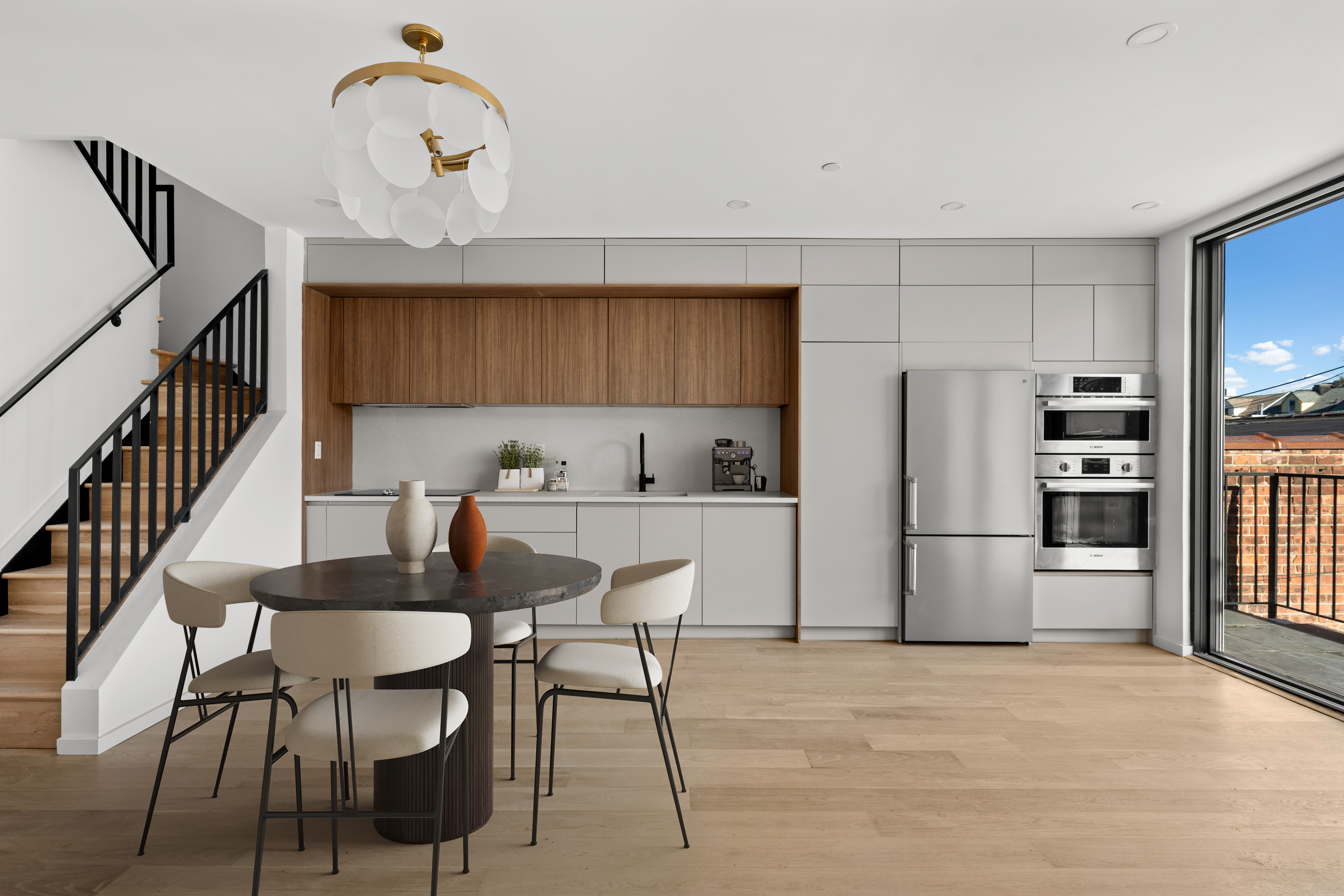 14-35 Broadway, Unit 1A Queens, NY 11106 - Photo 2 of 20 a kitchen with refrigerator cabinets and dining table