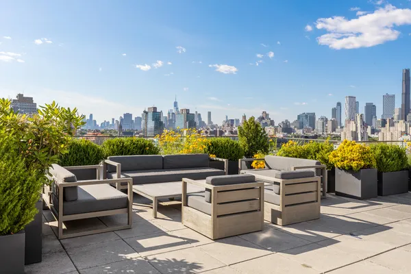 a outdoor living space with furniture and a garden