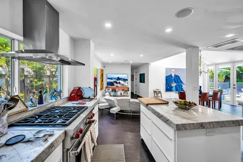 a kitchen with stainless steel appliances granite countertop a stove and a sink