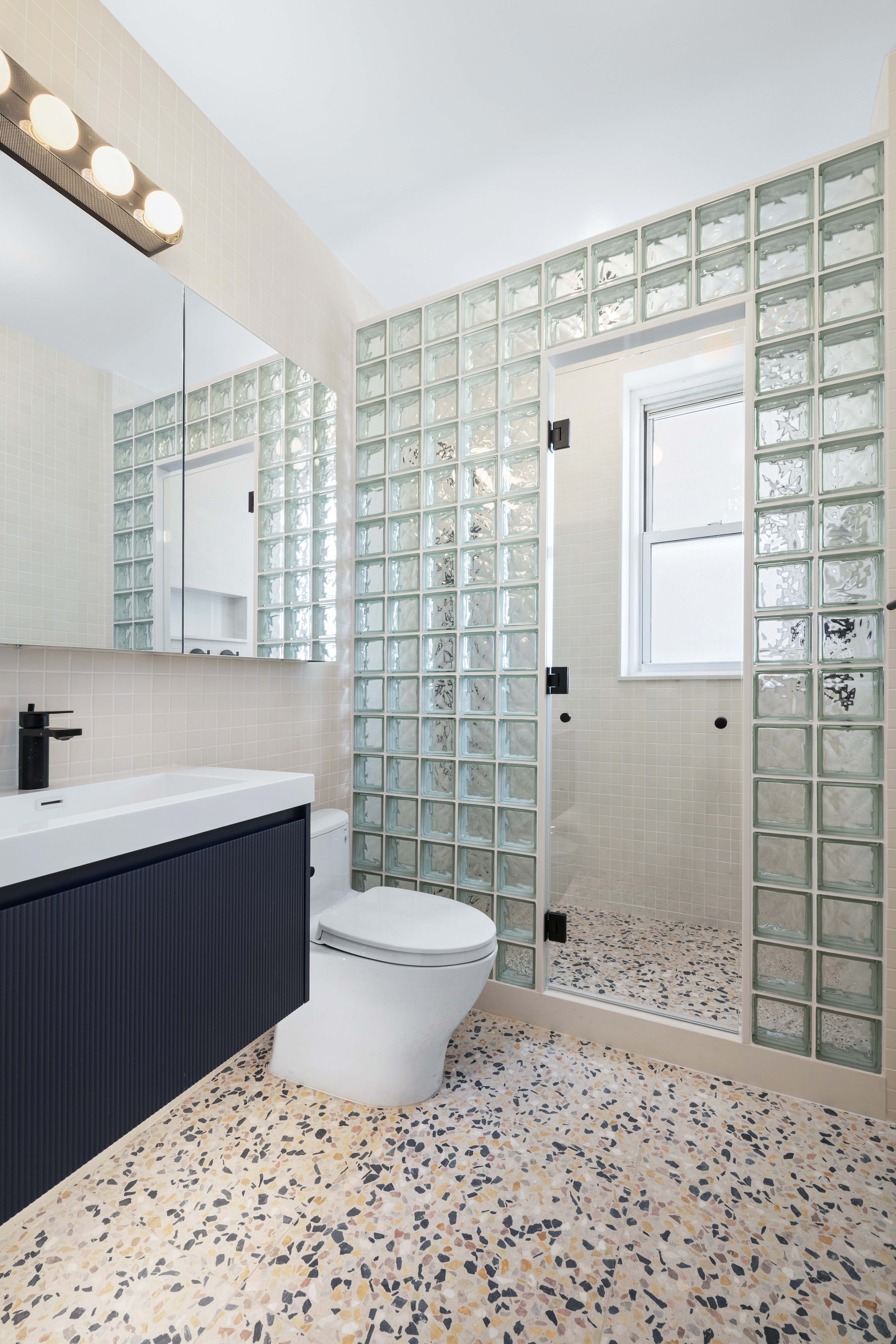 600 West 115th Street, Unit 1004 Manhattan, NY 10025 - Photo 8 of 13 a bathroom with a sink toilet and shower