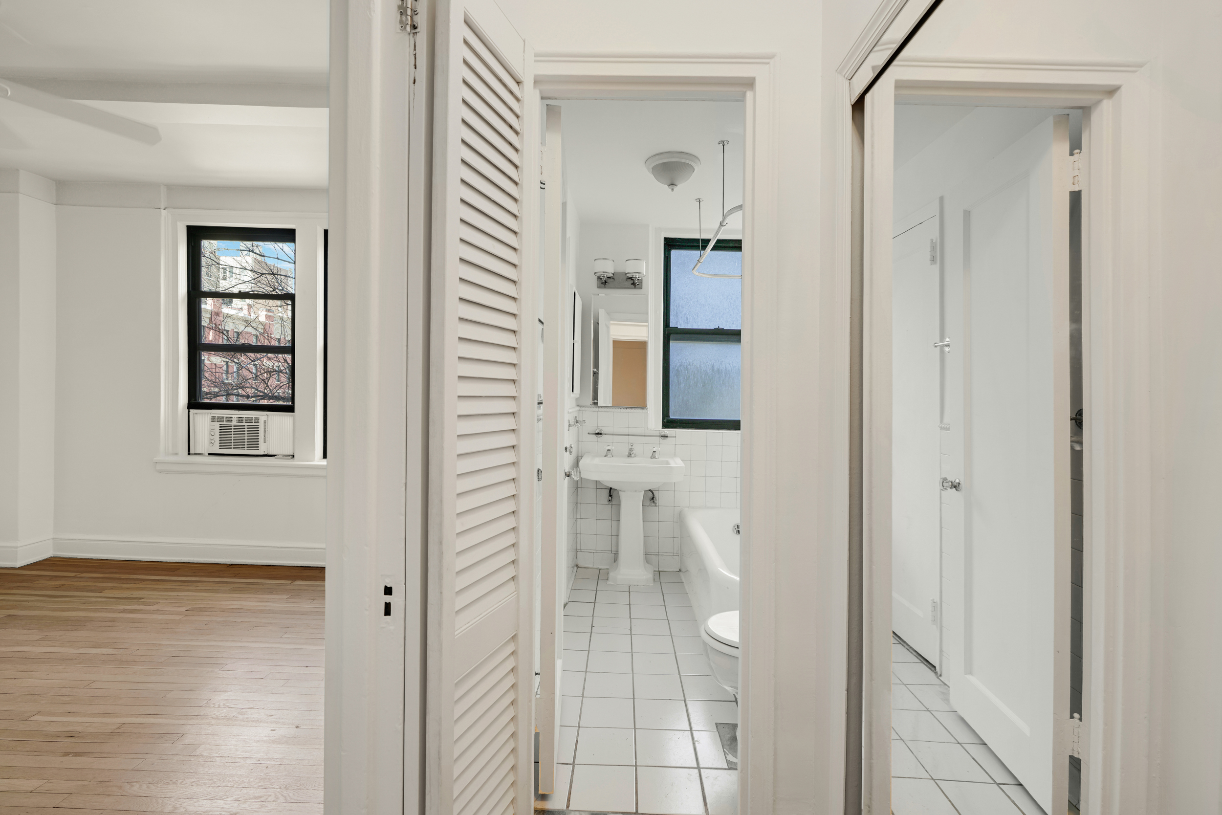 74 West 68th Street, Unit 5A Manhattan, NY 10023 - Photo 12 of 25 a bathroom with a shower and a sink