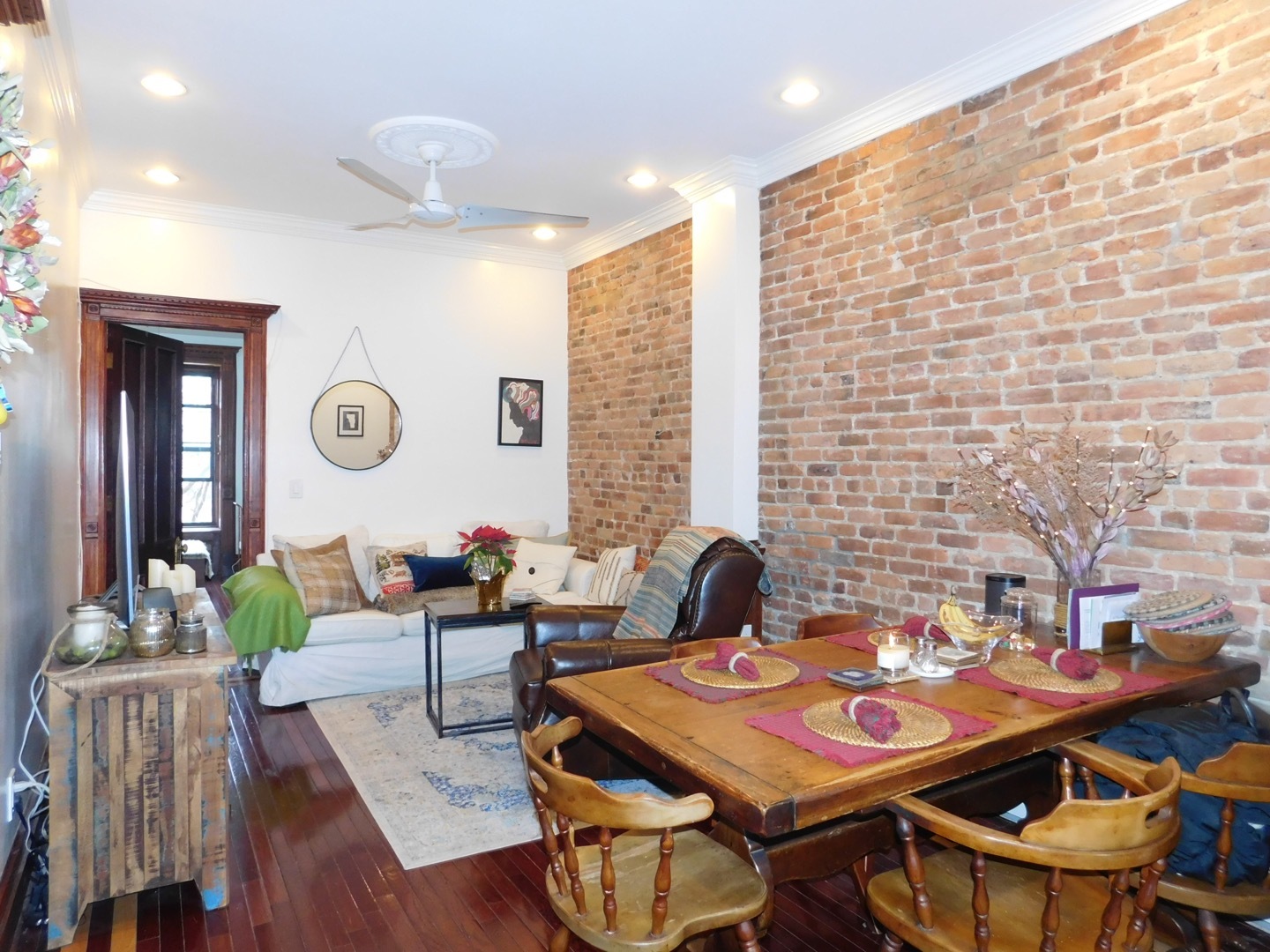132 Underhill Avenue, Unit 2 Brooklyn, NY 11238 - Photo 2 of 9 a living room with furniture and wooden floor