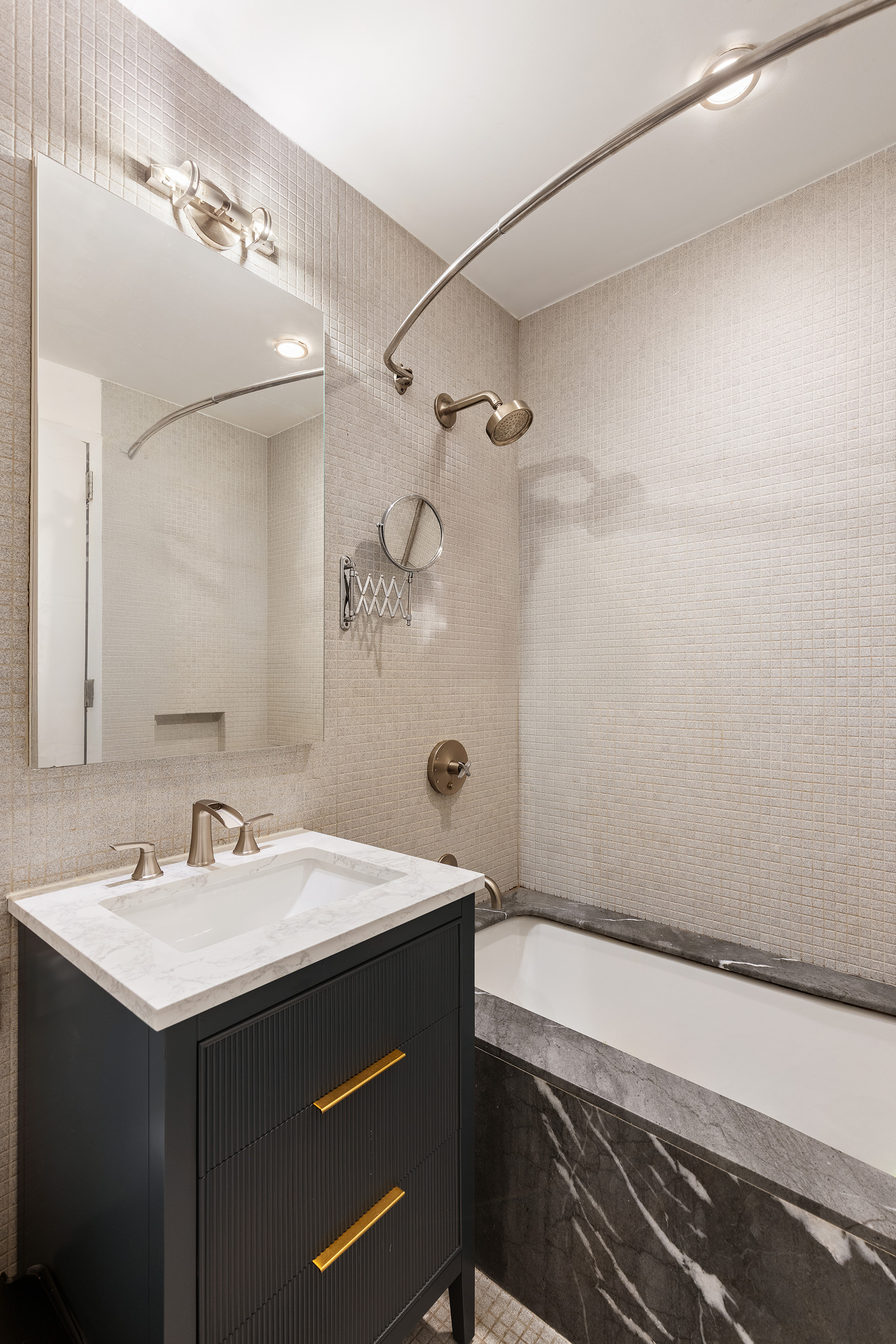 210 Lafayette Street, Unit 2D Manhattan, NY 10012 - Photo 11 of 14 a bathroom with a sink and a mirror